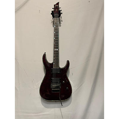 ESP Used 2006 ESP LTD H1001QM Deluxe Floyd Rose See Thru Black Cherry Solid Body Electric Guitar