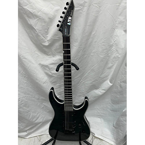 ESP Used ESP LTD MH1000 With Evertune Trans Black Solid Body Electric Guitar Trans Black