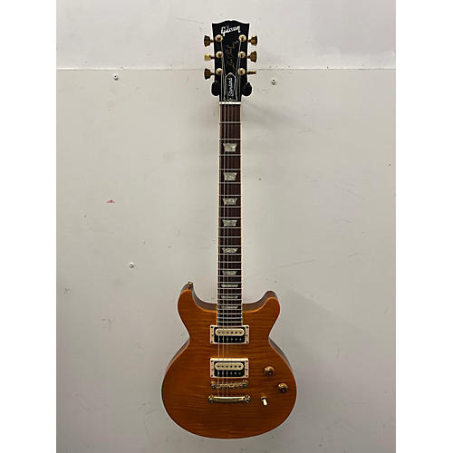 Gibson Used Gibson Les Paul Standard Double Cut Trans Amber Solid Body Electric Guitar Trans Amber