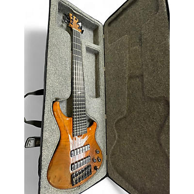 Used Roscoe SKB3006 Milky Honey Burst Electric Bass Guitar