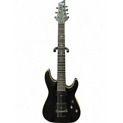 Used Schecter Guitar Research Demon 7 String Black and Gold Solid Body Electric Guitar